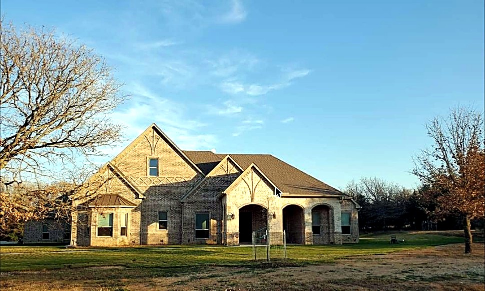 Wide view of a completed masonry home exterior